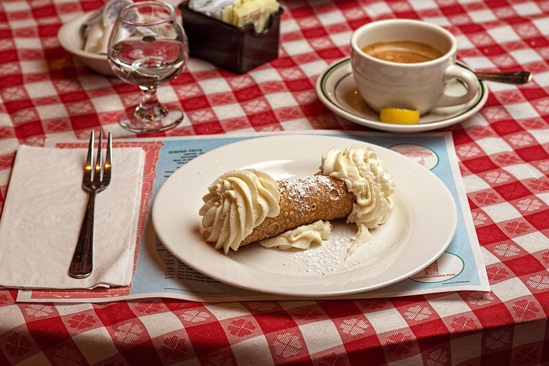 Cannoli dessert with cup of coffee