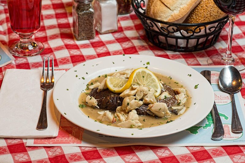 Steak Maryland entree with a basket of bread