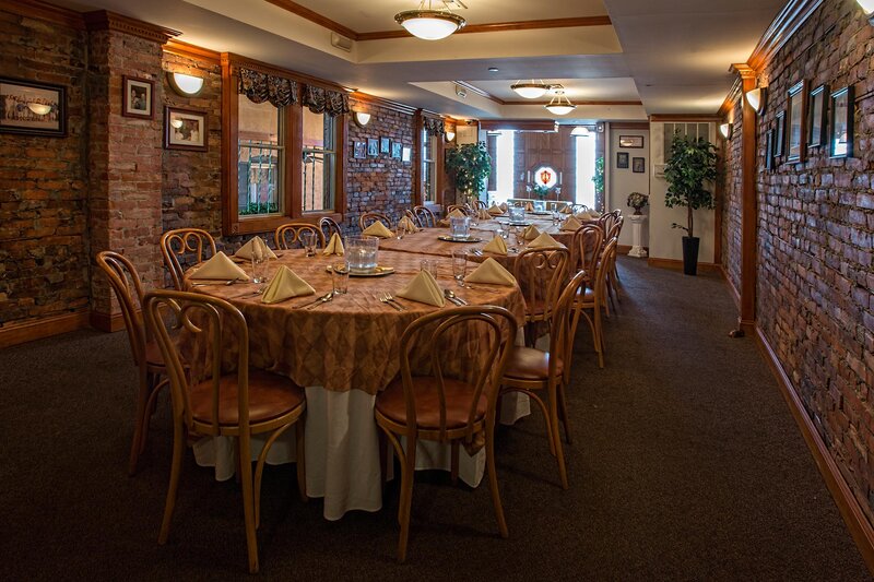 Private dining room with set table for 20